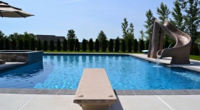 Geometric Pool with Diving Board, Raised Spa, and Slide