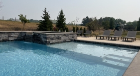 Custom-Pool-with-Raised-Spa-Spill-Over-and-Tanning-Ledge