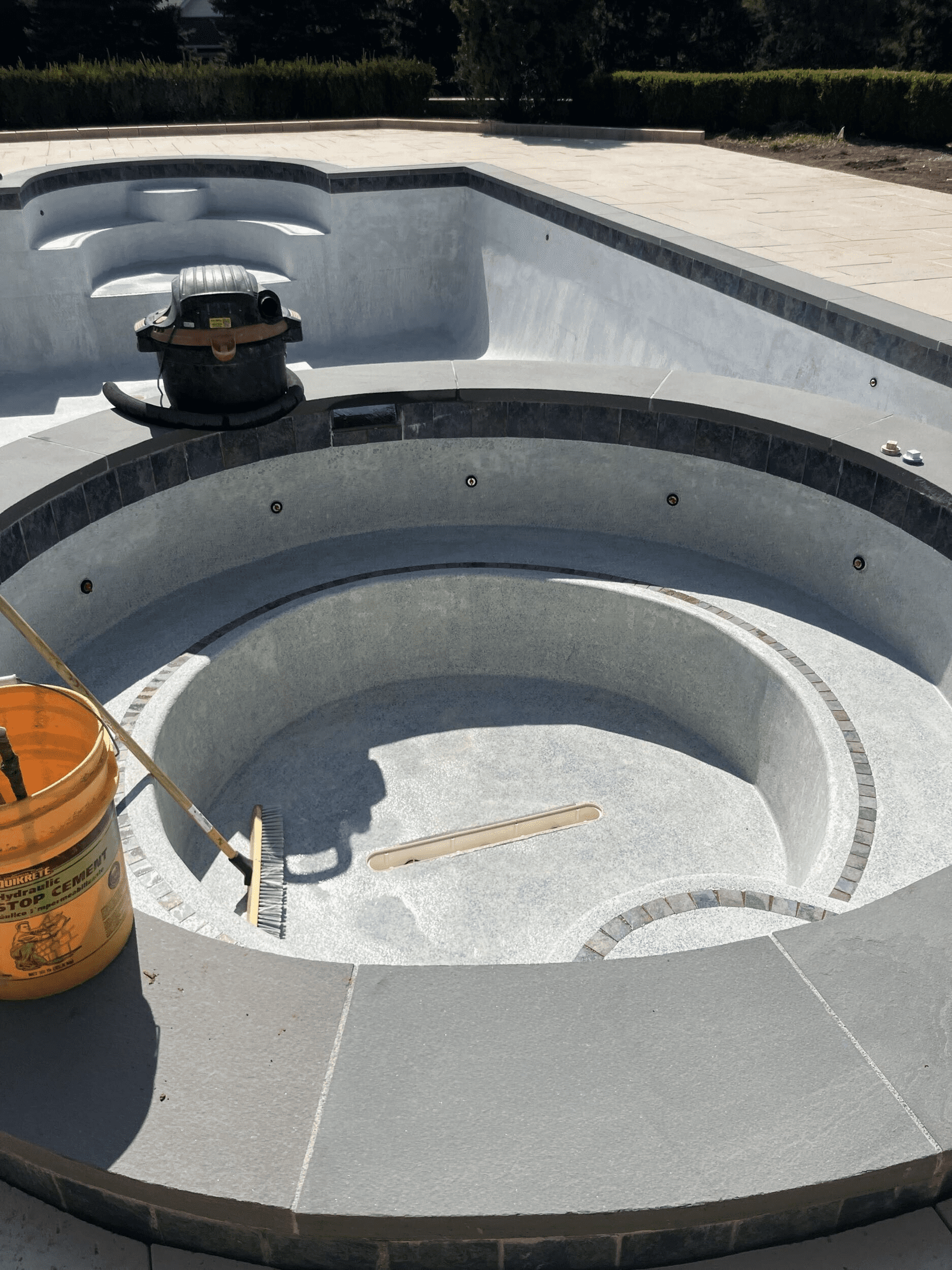 Pool and spa being refinished during the Collegeville renovation by Blue Tree Outdoor Living