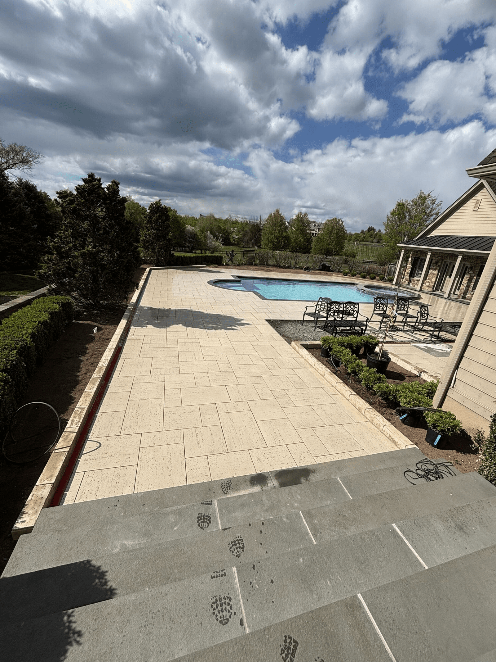 Renovated pool and outdoor living space in Collegeville, Pennsylvania by Blue Tree Outdoor Living