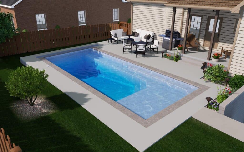 Backyard with a rectangular swimming pool, surrounded by grass, a wooden fence, outdoor furniture, and a covered patio attached to a house. Plants and flowers decorate the patio area.