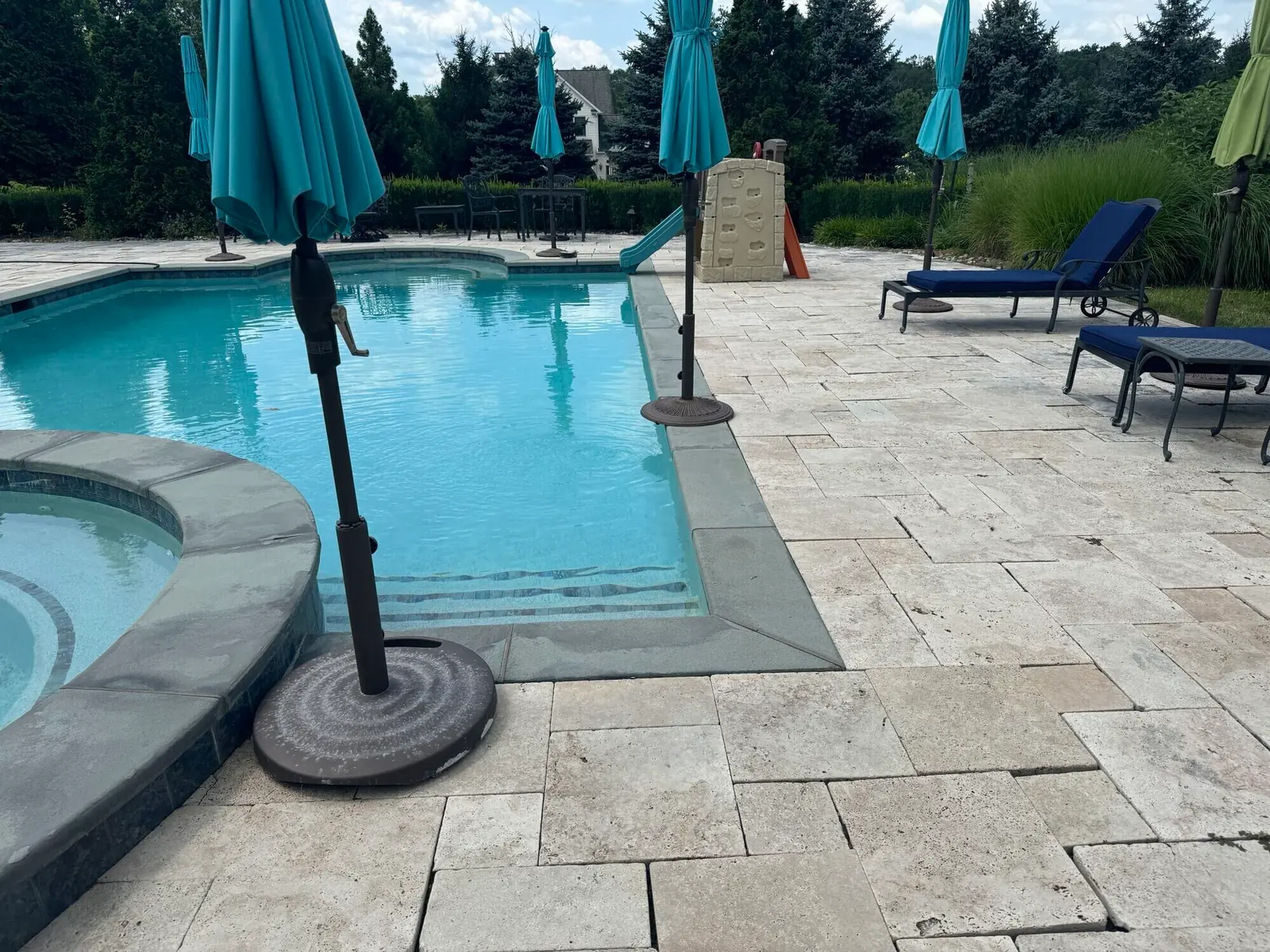 Loose pool coping and patio before renovation in Collegeville, PA