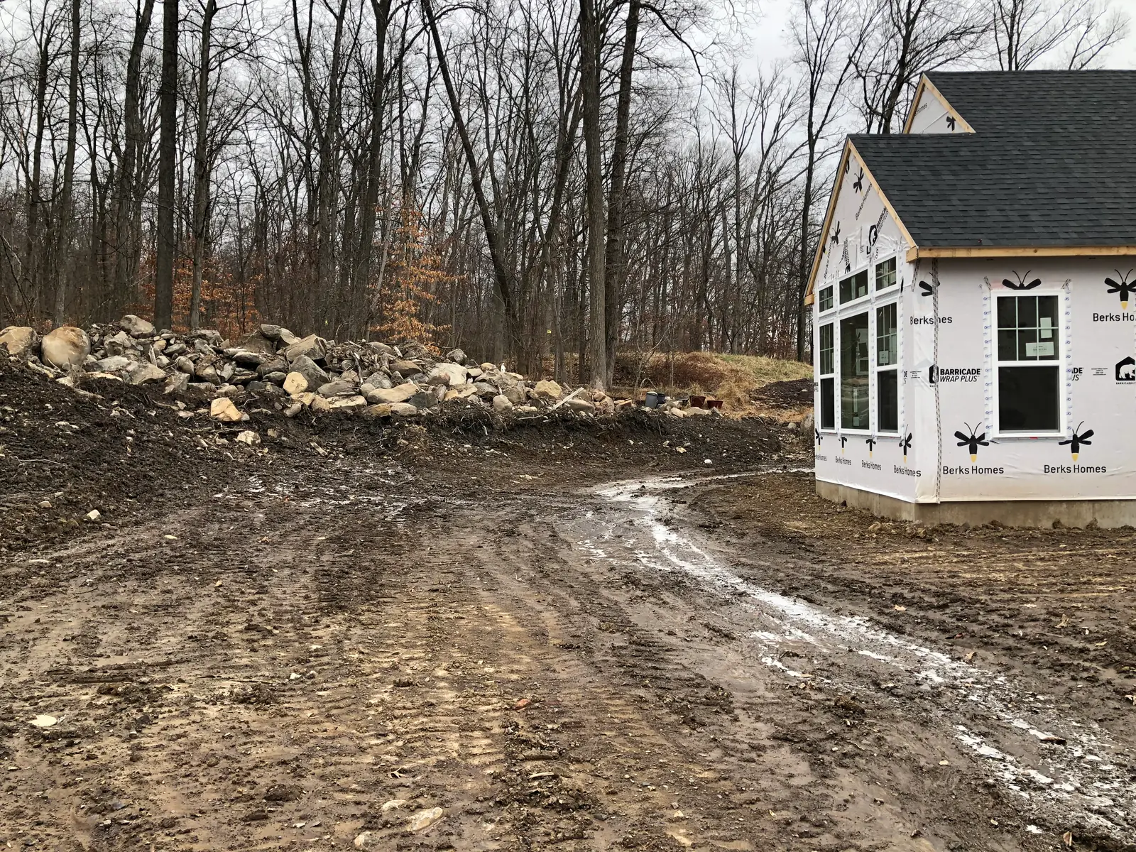 Unfinished backyard site before a pool and outdoor living build in Pottstown, PA