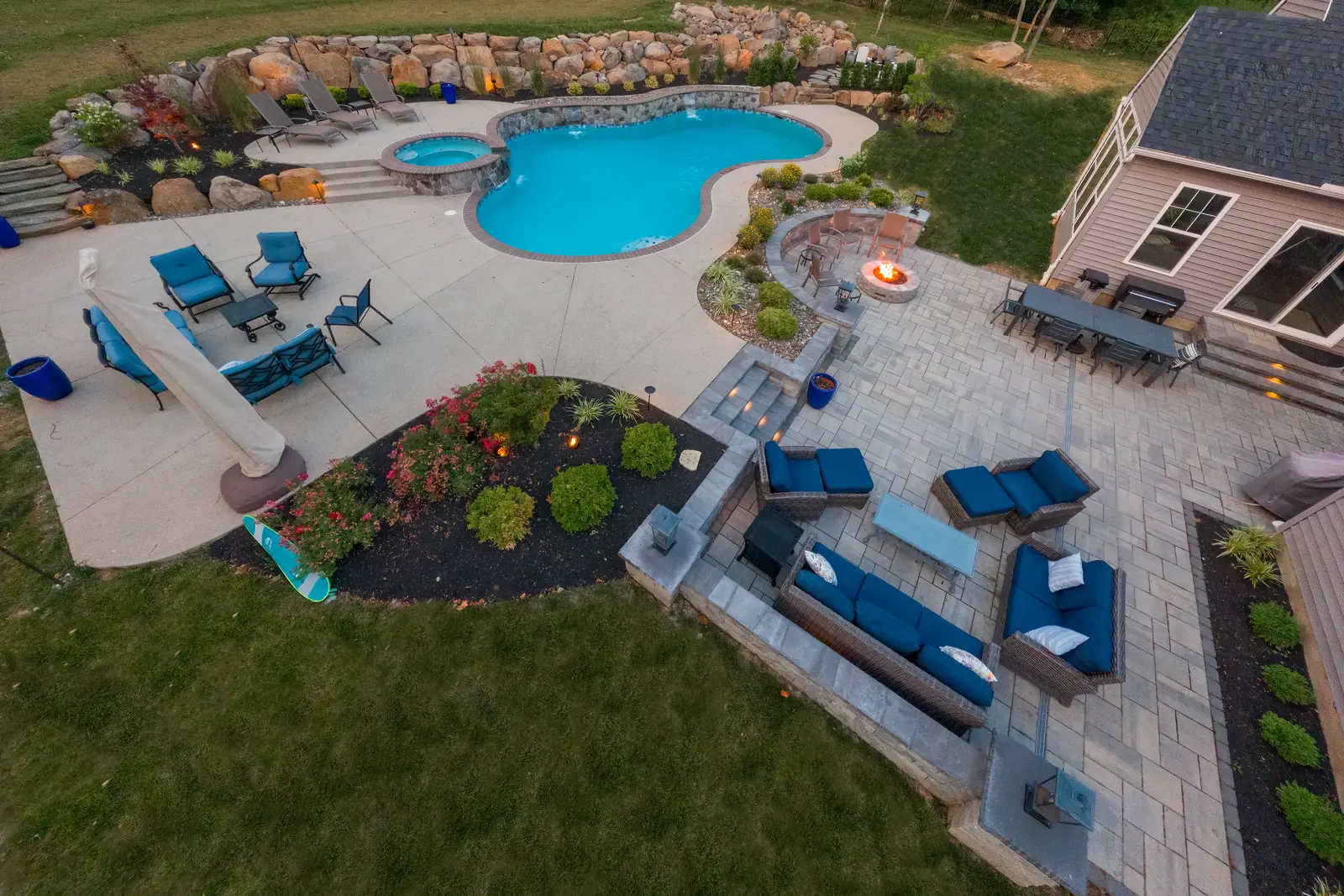 Aerial view of a custom pool, spa, patio, and fire pit in Pottstown, PA
