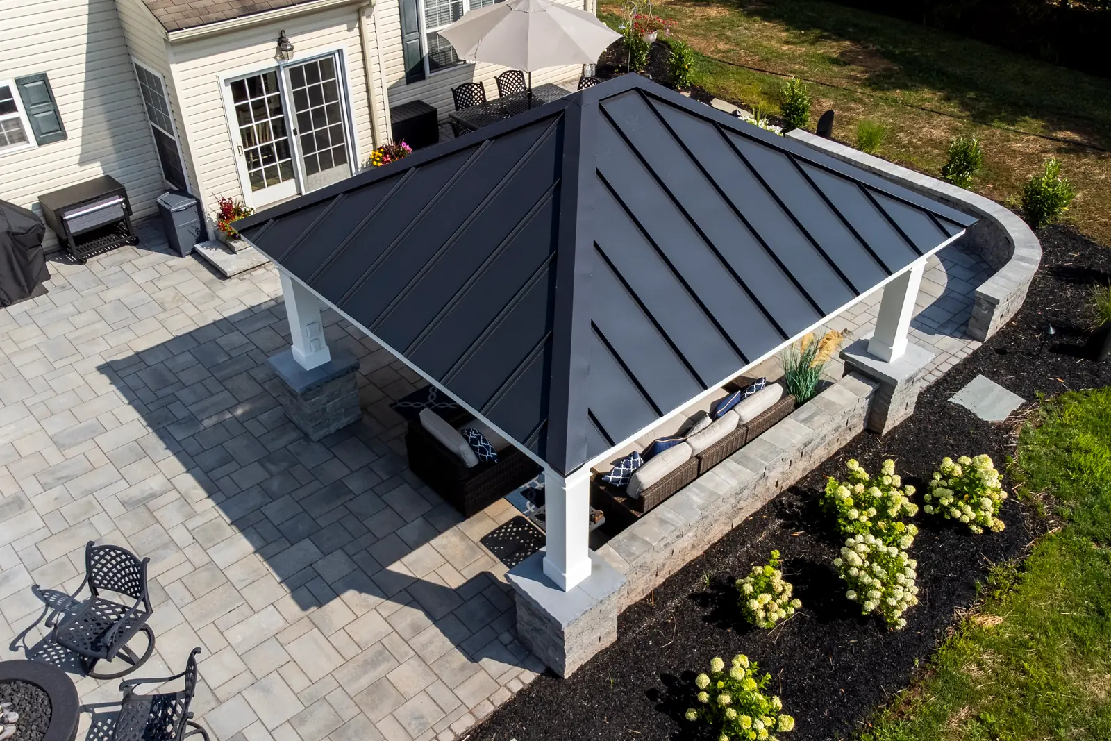 Aerial view of a roofed patio and outdoor living zones in Skippack, PA