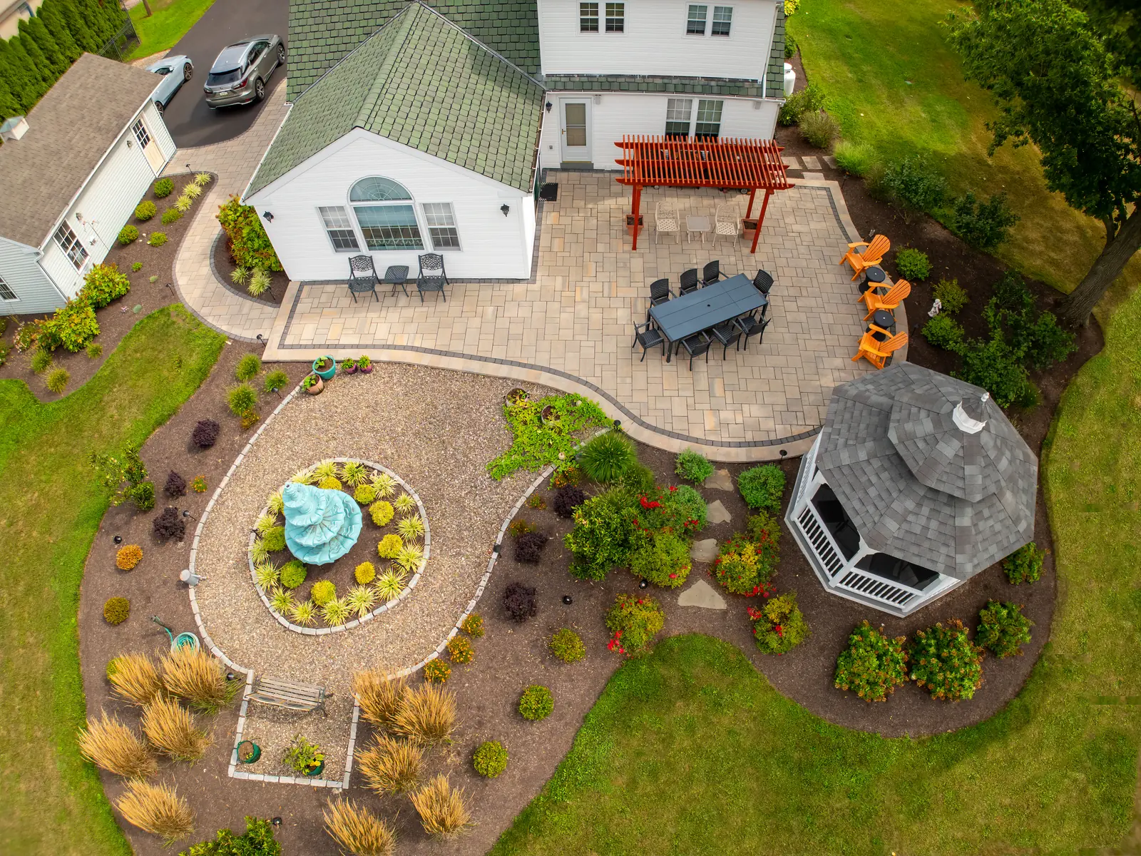 Aerial view of a finished patio, gazebo, fountain, and landscape in Telford, PA