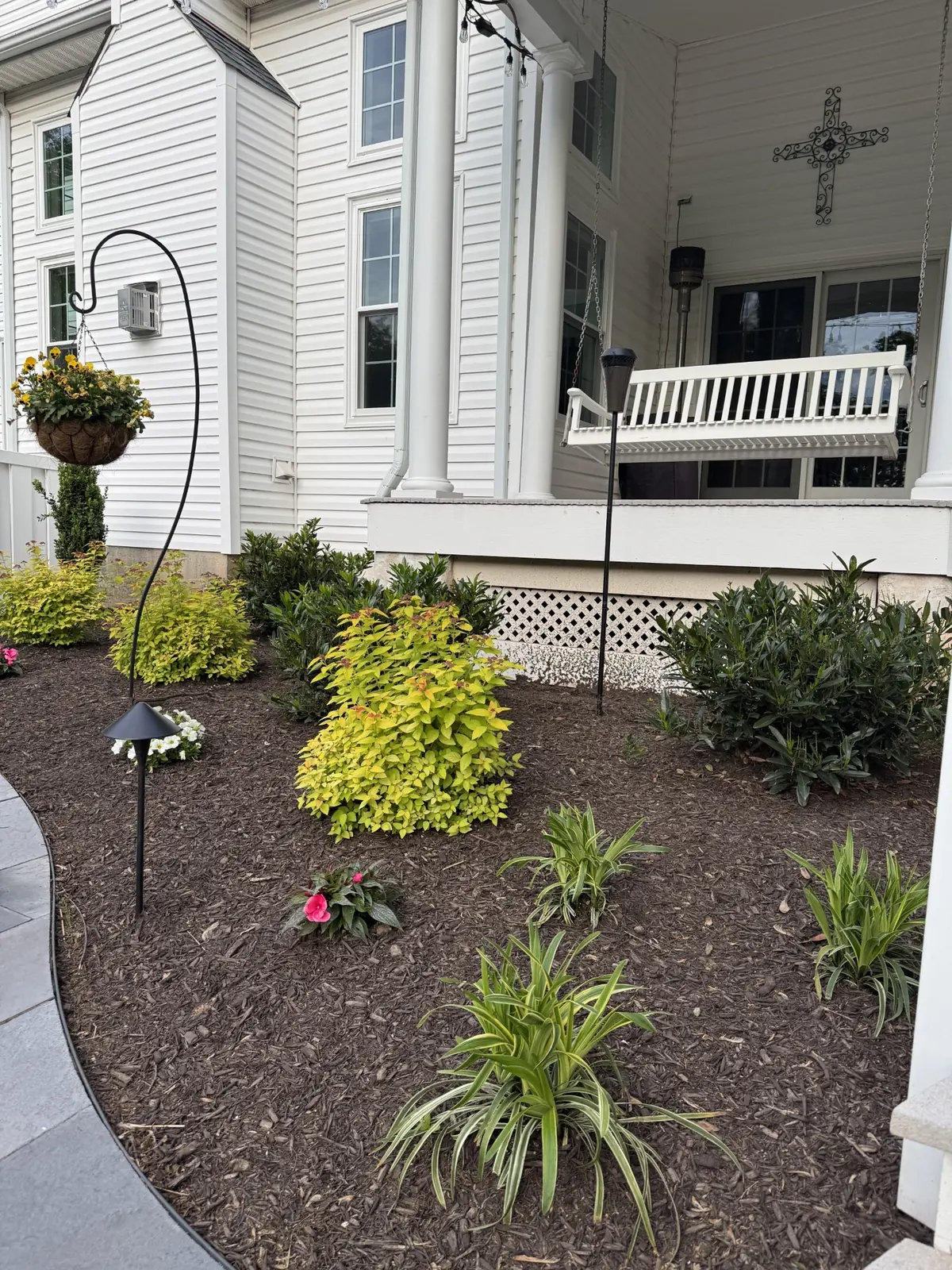 New planting bed beside a backyard patio in Upper Providence, PA