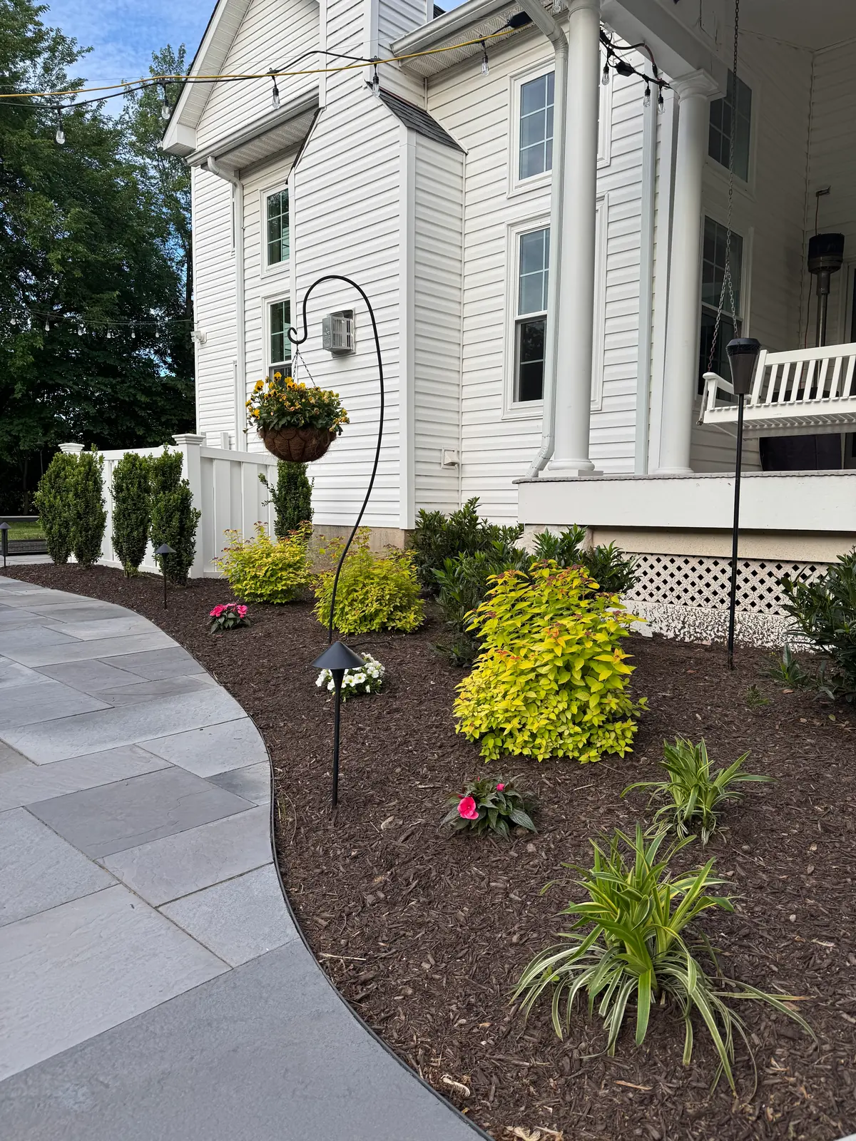 Curved walkway and new backyard plantings in Upper Providence, PA