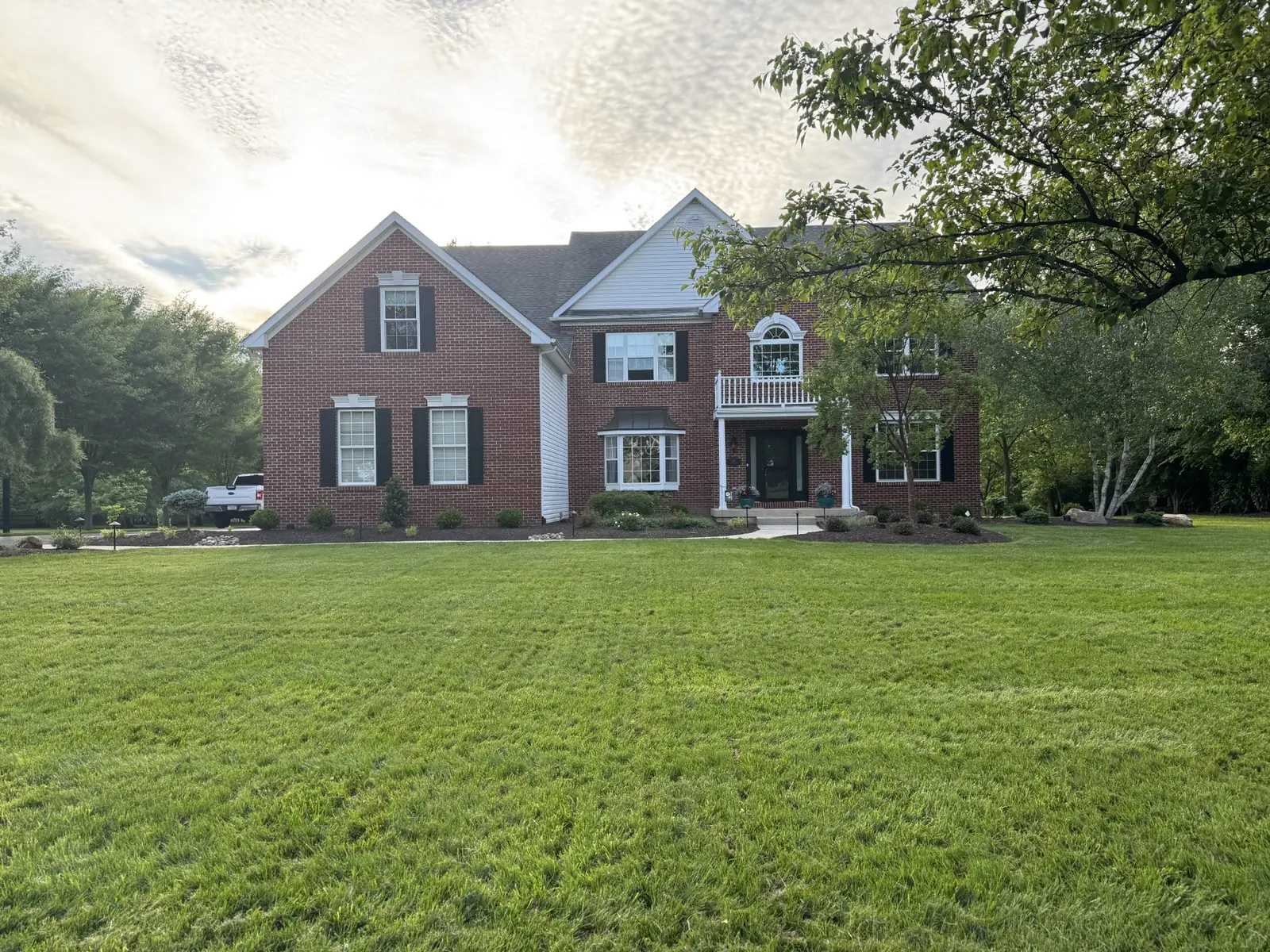 Finished front landscape at a brick home in Upper Providence, PA