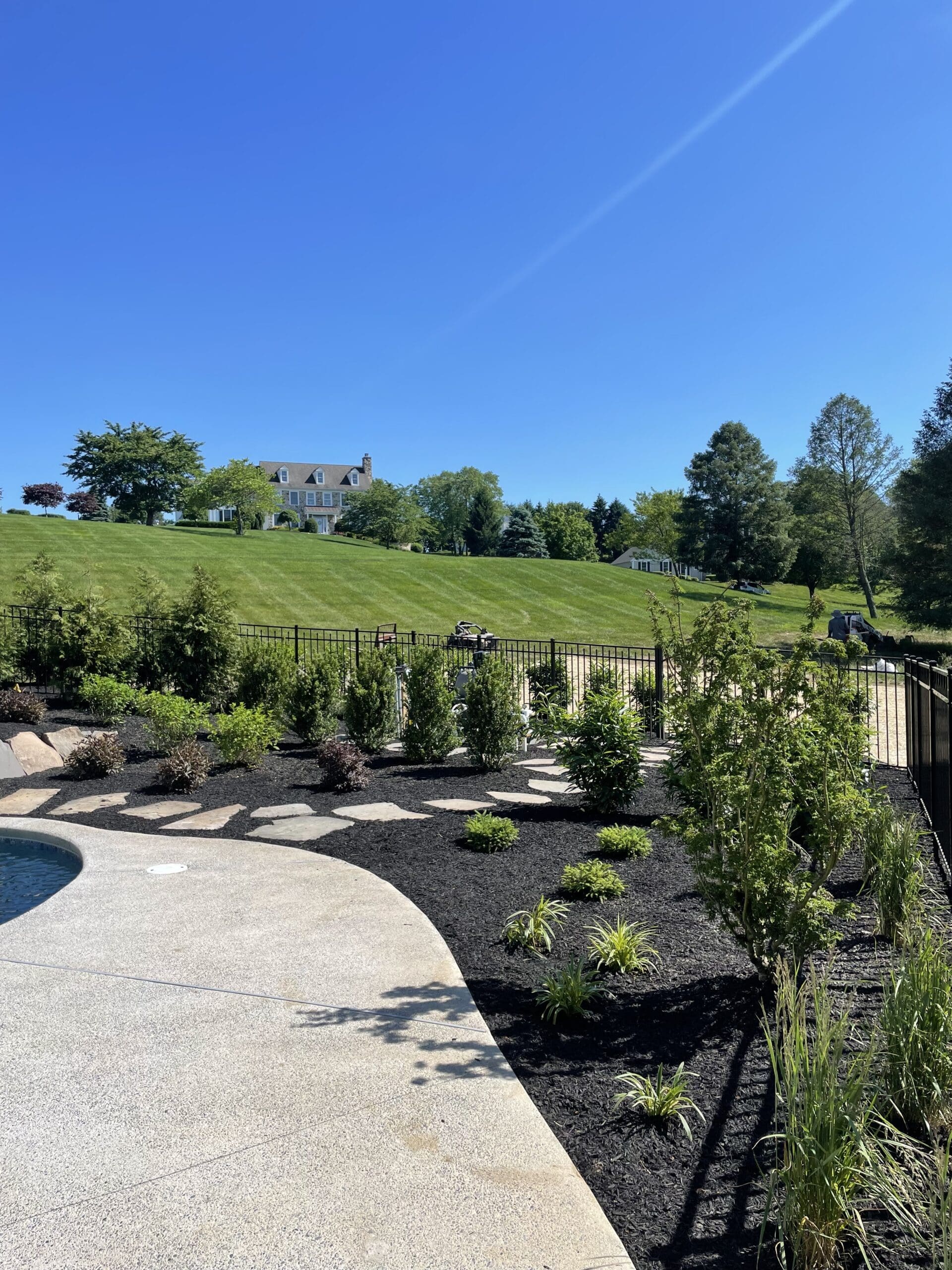 Custom pool on a sloped lot in West Chester, Pennsylvania